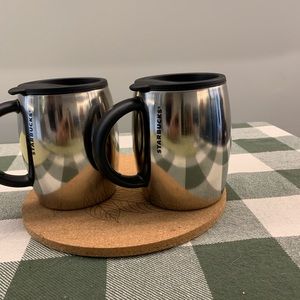 Starbucks stainless steel travel mugs.